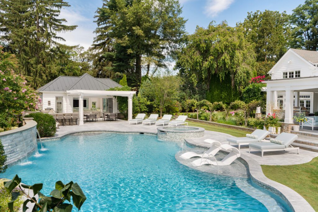 Resort-Style Pool Pavilion Framed by the Garden and Water Motion