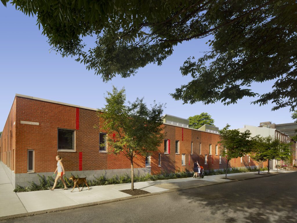 Urban Street Edge Softened by Plantings and Civic Integration