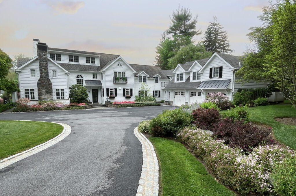 Formal Arrival Court Framed by Garden Borders and Architectural Balance
