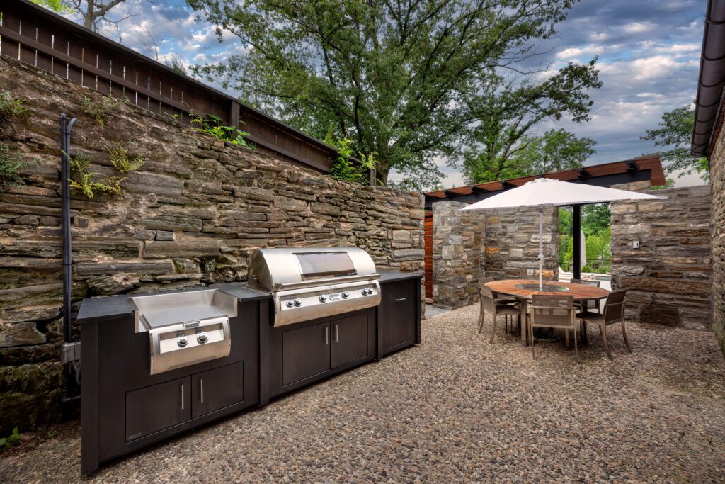 Walled Outdoor Kitchen Offering Privacy and Purposeful Design