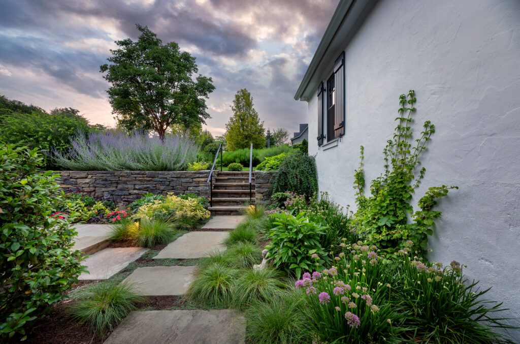 Layered Garden Path Framing Soft Elevation and Stonework